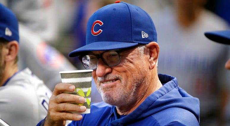 Chicago Cubs manager Joe Maddon salutes a fan from the dugout before a baseball game against the Pittsburgh Pirates in Pittsburgh, Wednesday, Sept. 25, 2019. ( Chicago Cubs manager Joe Maddon salutes a fan from the dugout before a baseball game against the Pittsburgh Pirates in Pittsburgh, Wednesday, Sept. 25, 2019. (