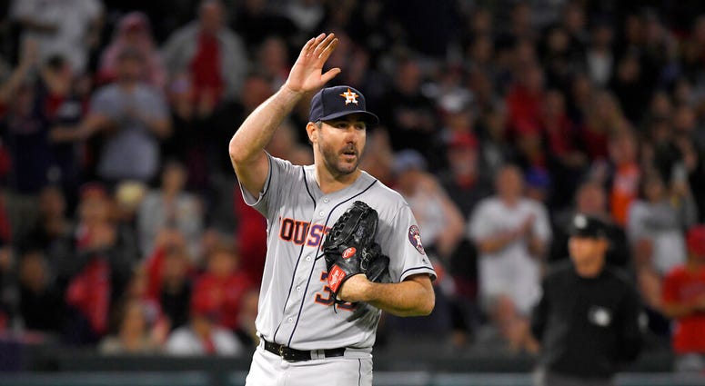 Houston Astros starting pitcher Justin Verlander waves to fans striking out Los Angeles Angels' Kole Calhoun forays 3,000th career strikeout during the fourth inning of a baseball game Saturday, Sept. 28, 2019, in Anaheim, Calif. Houston Astros starting pitcher Justin Verlander waves to fans striking out Los Angeles Angels' Kole Calhoun forays 3,000th career strikeout during the fourth inning of a baseball game Saturday, Sept. 28, 2019, in Anaheim, Calif.