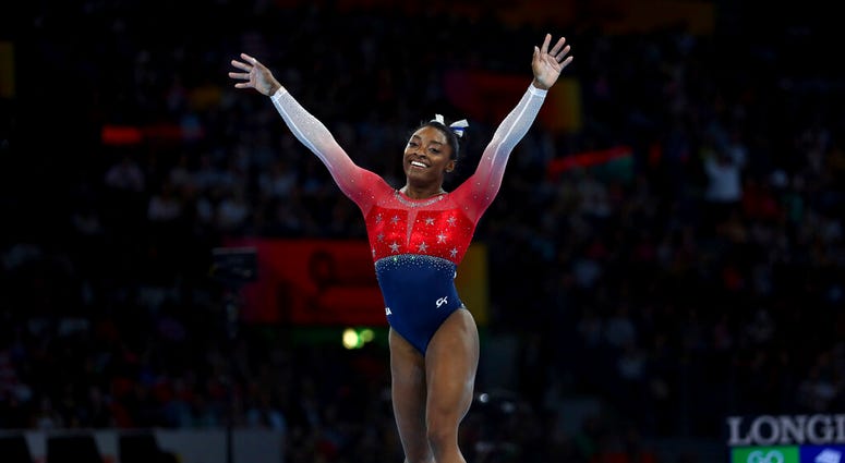 Simone Biles of the U.S. celebrates on the floor during women's team final at the Gymnastics World Championships in Stuttgart, Germany, Tuesday, Oct. 8, 2019. Simone Biles of the U.S. celebrates on the floor during women's team final at the Gymnastics World Championships in Stuttgart, Germany, Tuesday, Oct. 8, 2019.