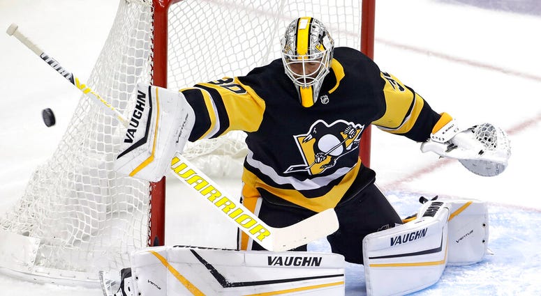 Pittsburgh Penguins goaltender Matt Murray blocks a shot during the first period of an NHL hockey game against the Winnipeg Jets in Pittsburgh, Tuesday, Oct. 8, 2019. Pittsburgh Penguins goaltender Matt Murray blocks a shot during the first period of an NHL hockey game against the Winnipeg Jets in Pittsburgh, Tuesday, Oct. 8, 2019.
