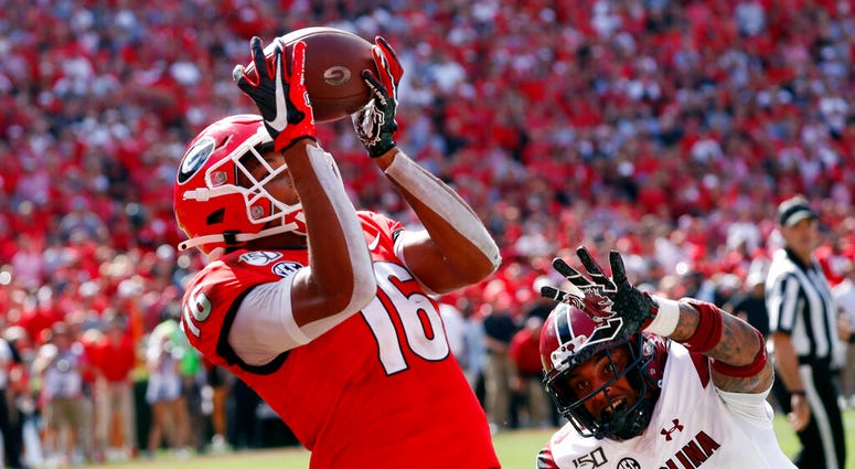Georgia wide receiver Demetris Robertson (16) catches a pass for a touchdown as South Carolina defensive back R.J. Roderick (10) defends in the second half of an NCAA college football game Saturday, Oct. 12, 2019, in Athens, Ga. Georgia wide receiver Demetris Robertson (16) catches a pass for a touchdown as South Carolina defensive back R.J. Roderick (10) defends in the second half of an NCAA college football game Saturday, Oct. 12, 2019, in Athens, Ga.