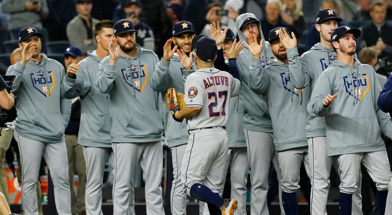 Houston Astros second baseman Jose Altuve celebrates with teammates after their 4-1 win against the New York Yankees in Game 3 of baseball's American League Championship Series Tuesday, Oct. 15, 2019, in New York.