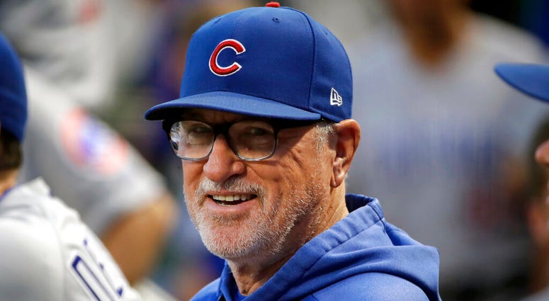 In this Sept. 25, 2019, file photo, then-Chicago Cubs manager Joe Maddon stands in the dugout before a baseball game against the Pittsburgh Pirates, in Pittsburgh.