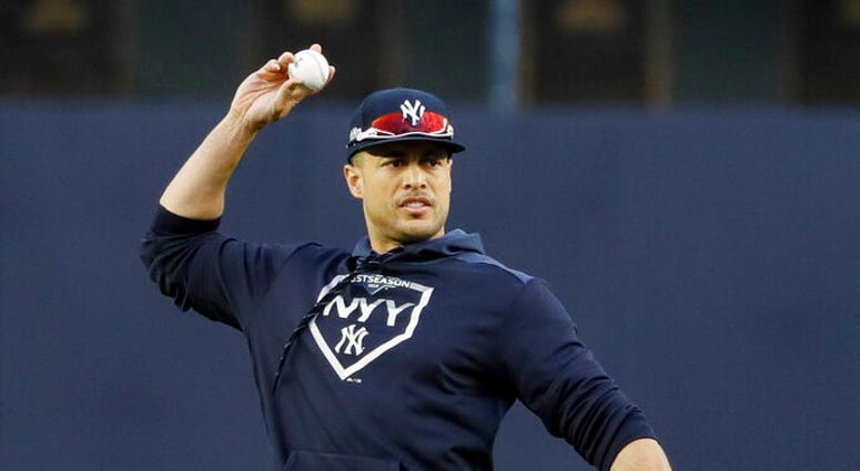 New York Yankees left fielder Giancarlo Stanton warms up during batting practice before Game 4 of baseball's American League Championship Series against the Houston Astros Thursday, Oct. 17, 2019, in New York. New York Yankees left fielder Giancarlo Stanton warms up during batting practice before Game 4 of baseball's American League Championship Series against the Houston Astros Thursday, Oct. 17, 2019, in New York.