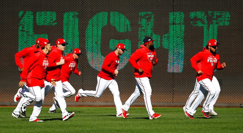 Members of the Washington Nationals participate in a baseball workout, Friday, Oct. 18, 2019, in Washington, in advance of the team's appearance in the World Series. Members of the Washington Nationals participate in a baseball workout, Friday, Oct. 18, 2019, in Washington, in advance of the team's appearance in the World Series.