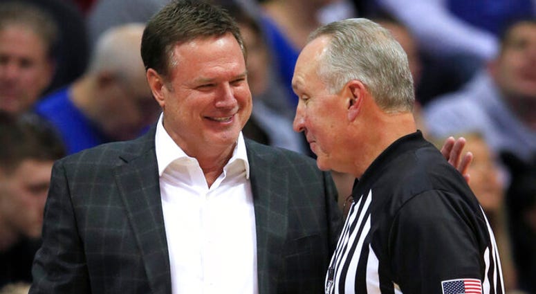 Kansas coach Bill Self, left, talks with referee Joe DeRosa, right, during the first half of the team's exhibition NCAA college basketball game against Pittsburg State in Lawrence, Kan., Thursday, Oct. 31, 2019 AP DO NOT USE