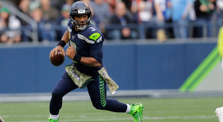 Seattle Seahawks quarterback Russell Wilson scrambles against the Tampa Bay Buccaneers during the second half of an NFL football game, Sunday, Nov. 3, 2019, in Seattle. AP DO NOT USE