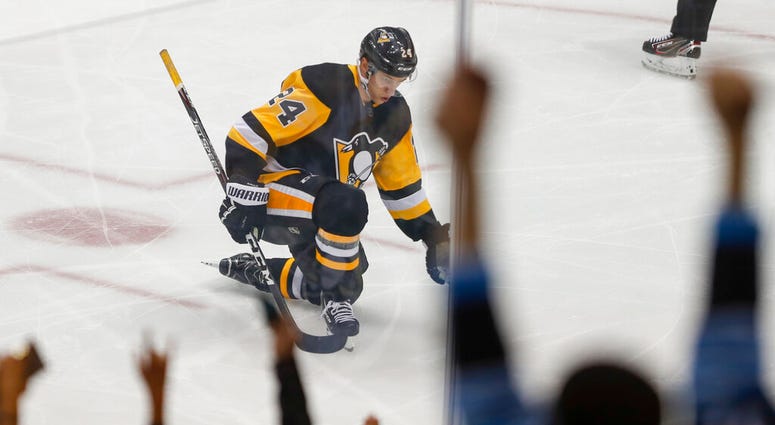 Pittsburgh Penguins' Dominik Kahun celebrates along with the fans after scoring against the New Jersey Devils during the first period of an NHL hockey game, Friday, Nov. 22, 2019, in Pittsburgh. Pittsburgh Penguins' Dominik Kahun celebrates along with the fans after scoring against the New Jersey Devils during the first period of an NHL hockey game, Friday, Nov. 22, 2019, in Pittsburgh.