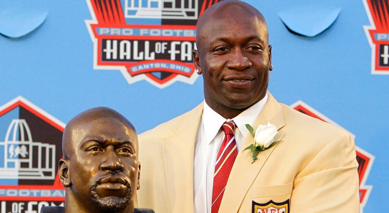 -In this Aug. 7, 2010, file photo, Former Minnesota Vikings great John Randle poses with his bust after enshrinement in the Pro Football Hall of Fame in Canton, Ohio Saturday, Aug. 7, 2010. AP DO NOT USE