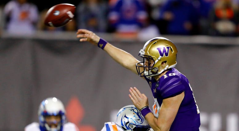 Washington quarterback Jacob Eason (10) passes under pressure from Boise State nose tackle Scale Igiehon (90) during the second half of the Las Vegas Bowl NCAA college football game at Sam Boyd Stadium, Saturday, Dec. 21, 2019, in Las Vegas. Washington quarterback Jacob Eason (10) passes under pressure from Boise State nose tackle Scale Igiehon (90) during the second half of the Las Vegas Bowl NCAA college football game at Sam Boyd Stadium, Saturday, Dec. 21, 2019, in Las Vegas.