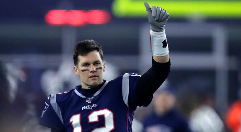 New England Patriots quarterback Tom Brady signals to a teammate before an NFL wild-card playoff football game against the Tennessee Titans, Saturday, Jan. 4, 2020, in Foxborough, Mass.