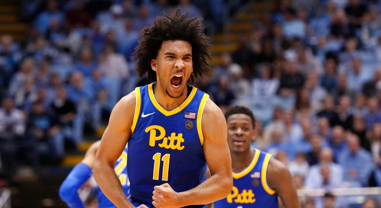 Pittsburgh guard Justin Champagnie (11) reacts following a basket against North Carolina during the second half of an NCAA college basketball game in Chapel Hill, N.C., Wednesday, Jan. 8, 2020.