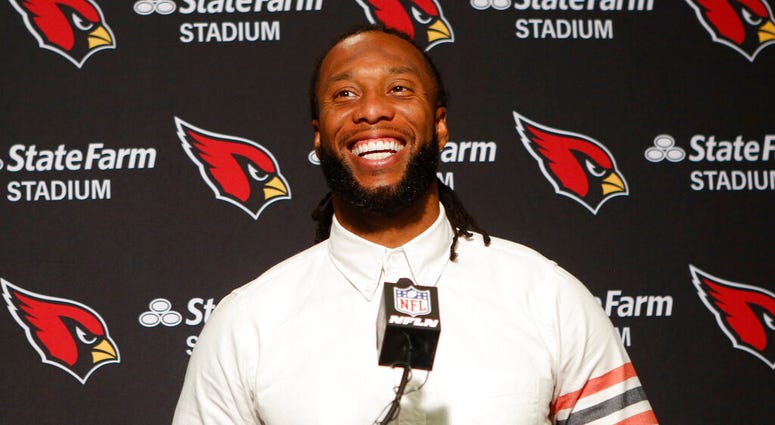 In this Oct. 6, 2019, file photo, Arizona Cardinals wide receiver Larry Fitzgerald attends a news conference after winning an NFL football game against the Cincinnati Bengals