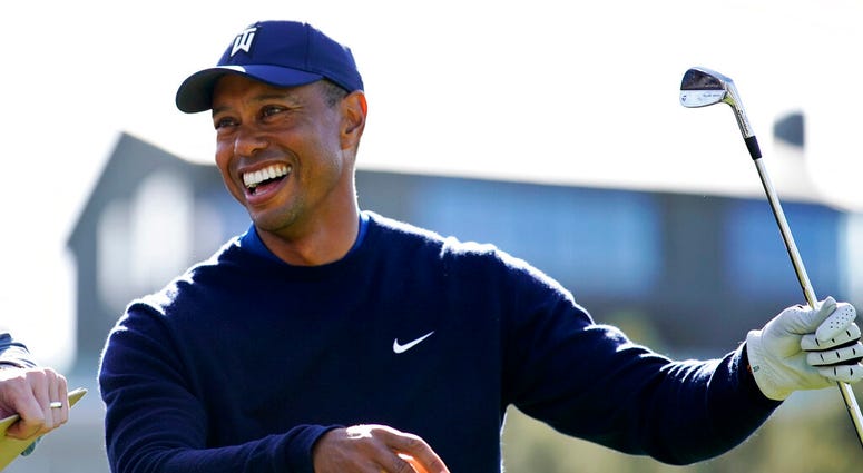 Tiger Woods smiles after hitting his tee shot on the 16th hole during the Genesis Invitational pro-am golf event at Riviera Country Club, Wednesday, Feb. 12, 2020, in the Pacific Palisades area of Los Angeles.