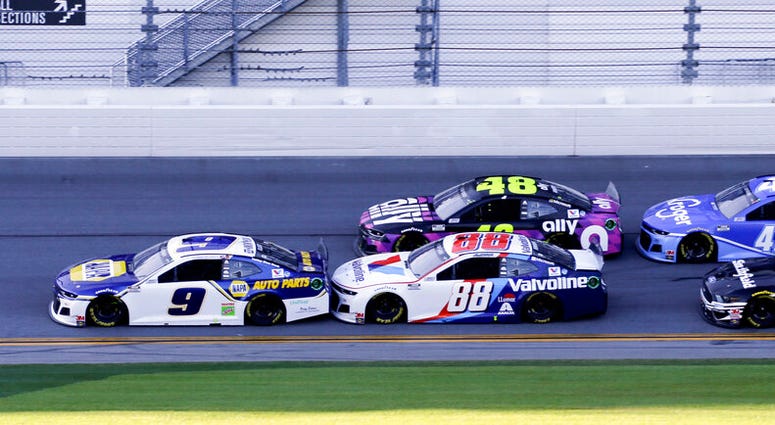 Chase Elliott (9), Alex Bowman (88), Jimmie Johnson (48), Ricky Stenhouse Jr. (47) and Aric Almirola (10) race down the front stretch during the NASCAR Daytona 500 auto race at Daytona International Speedway, Monday, Feb. 17, 2020, in Daytona Beach, Fla.