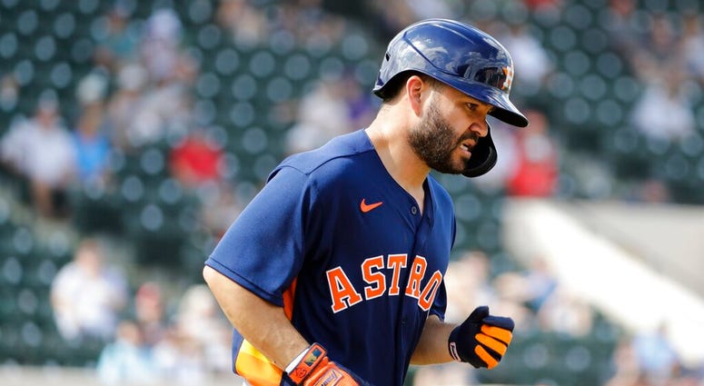 Houston Astros' Jose Altuve runs to first base after getting hit with a pitch during the fifth inning of a spring training baseball game against the Detroit Tigers, Monday, Feb. 24, 2020, in Lakeland, Fla.