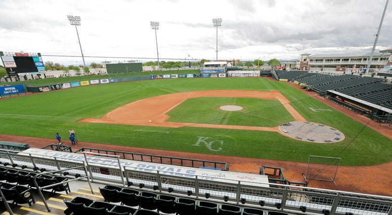 Kansas City Royals' dugout in an otherwise empty ballpark after the cancellation of a spring training baseball game between the Royals and the Seattle Mariners Thursday, March 12, 2020, in Surprise, Ariz.