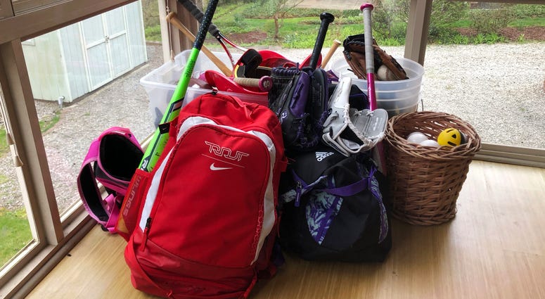Baseball and softball bags lie untouched. The spring seasons for both children's youth leagues are on hold and in danger of being canceled due to the COVID-19 pandemic. Baseball and softball bags lie untouched. The spring seasons for both children's youth leagues are on hold and in danger of being canceled due to the COVID-19 pandemic.