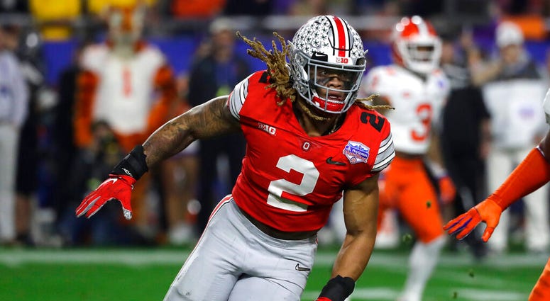 Ohio State defensive end Chase Young (2) moves in on the play during the first half of the Fiesta Bowl NCAA college football game against Clemson, in Glendale, Ariz. Young is a likely first round pick in the NFL Draft Thursday, April 23, 2020.