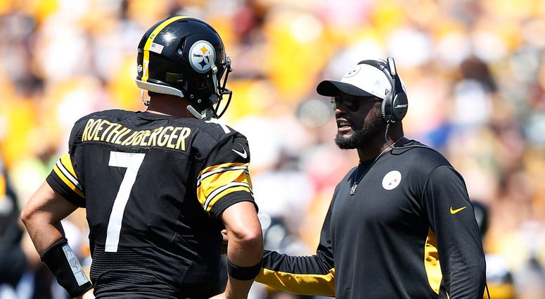 Head coach Mike Tomlin of the Pittsburgh Steelers talks with quarterback Ben Roethlisberger #7 Head coach Mike Tomlin of the Pittsburgh Steelers talks with quarterback Ben Roethlisberger #7