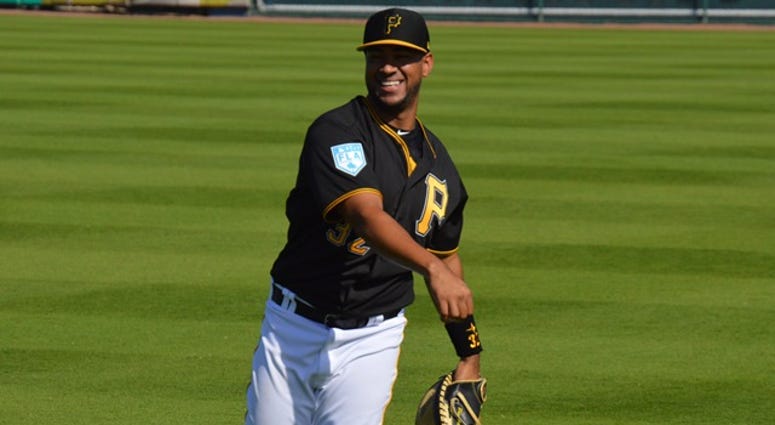 Elias Diaz throwing