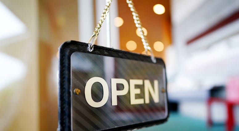 Open sign in business window Open sign in business window