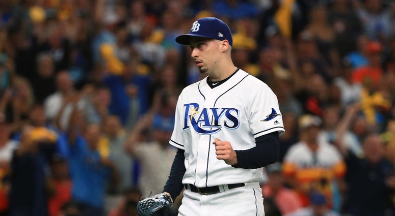 Blake Snell #4 of the Tampa Bay Rays celebrates his team's win. Blake Snell #4 of the Tampa Bay Rays celebrates his team's win.