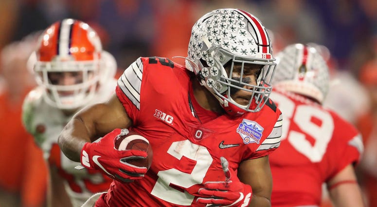 Running back J.K. Dobbins #2 of the Ohio State Buckeyes rushes the football against the Clemson Tigers. Running back J.K. Dobbins #2 of the Ohio State Buckeyes rushes the football against the Clemson Tigers.