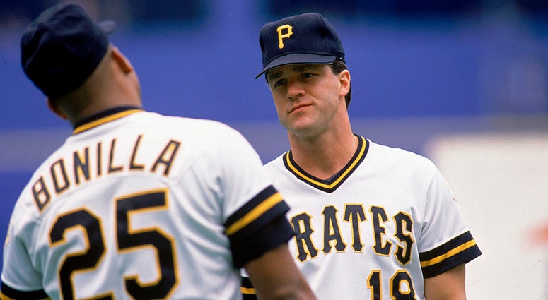 Andy Van Slyke #18 of the Pittsburgh Pirates talks with teammabte Bobby Bonilla #25 during a 1990 MLB season game at Three Rivers Stadium Andy Van Slyke #18 of the Pittsburgh Pirates talks with teammabte Bobby Bonilla #25 during a 1990 MLB season game at Three Rivers Stadium