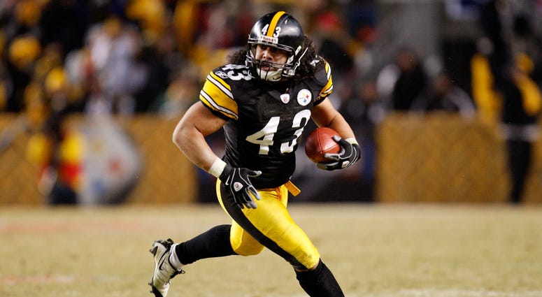 PITTSBURGH - JANUARY 18: Troy Polamalu #43 of the Pittsburgh Steelers returns an interception 40 yards for a touchdown against the Baltimore Ravens during the fourth quarter of the AFC championship game on January 18, 2009 at Heinz Field in Pittsburgh
