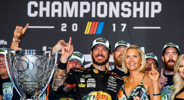 NASCAR Cup Series driver Martin Truex Jr. celebrates winning the NASCAR Cup Championship with his girlfriend Sherry Pollex Martin Truex Jr. Of Furniture Row Racing