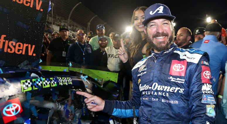 MARTINSVILLE, VIRGINIA - OCTOBER 27: Martin Truex Jr, driver of the #19 Auto Owners Insurance Toyota, poses with the winner's decal on his car in Victory Lane after winning the Monster Energy NASCAR Cup Series First Data 500 at Martinsville Speedway on Oc Mqrtin Truex Jr In Victory Lane After Winning NASCAR Cup Series Playoff Race At Martinsville Speedway