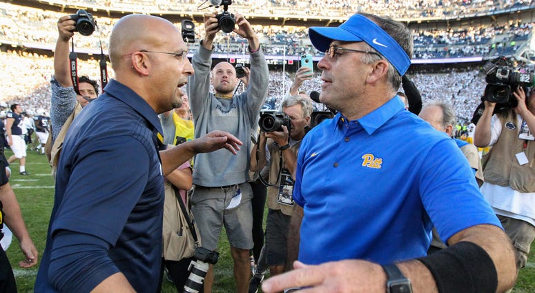 Penn State Nittany Lions head coach James Franklin (left) and Pittsburgh Panthers head coach Pat Narduzzi (right) congratulate each other at mid field following the competition of the game at Beaver Stadium