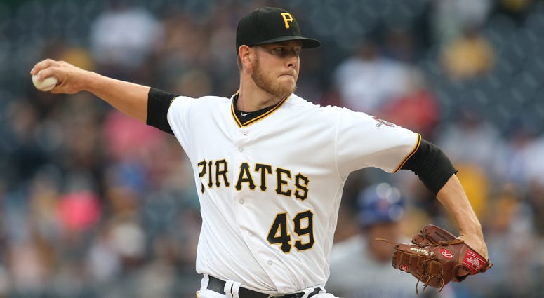 Pittsburgh Pirates starting pitcher Nick Kingham (49) delivers a pitch against the Chicago Cubs during the first inning at PNC Park.