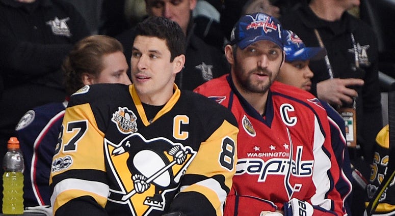 Pittsburgh Penguins forward Sidney Crosby sits next to Washington Capitals forward Alex Ovechkin Pittsburgh Penguins forward Sidney Crosby sits next to Washington Capitals forward Alex Ovechkin
