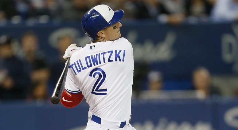 Troy Tulowitzki (2) hits a solo home run in the ninth inning against the Baltimore Orioles at Rogers Centre.