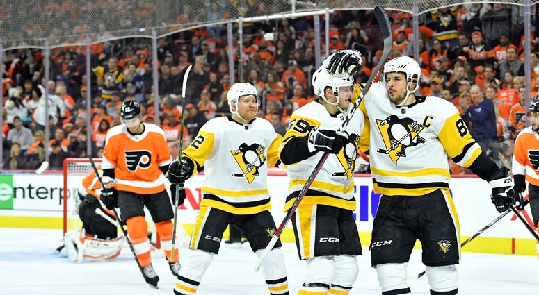 Pittsburgh Penguins Crosby celebrates a goal with Guentzel and Hornqvist Sidney Crosby