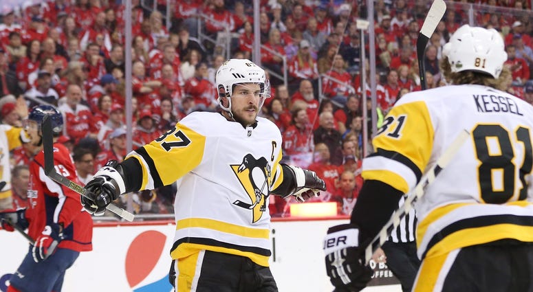 Washington, DC, USA; Pittsburgh Penguins center Sidney Crosby (87) celebrates with teammates after scoring a goal against the Washington Capitals