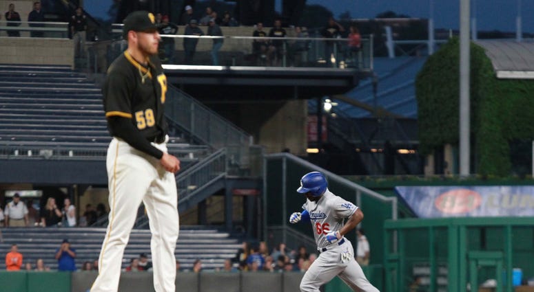 Los Angeles Dodgers right fielder Yasiel Puig (66) circles the bases on a solo home against Pittsburgh Pirates starting pitcher Joe Musgrove Joe Musgrove