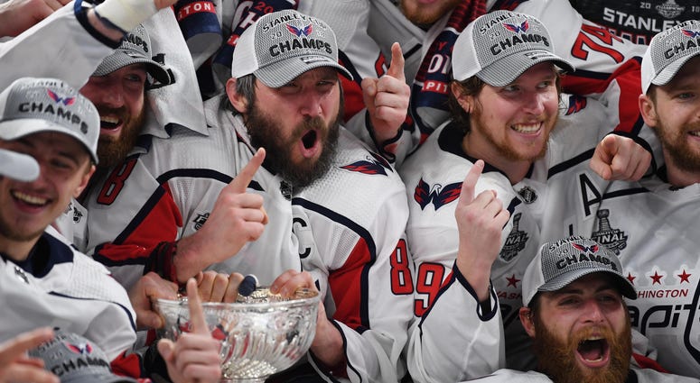 Las Vegas, NV, USA; Washington Capitals players including Alex Ovechkin (8) pose for a team photo with the Stanley Cup Capitals