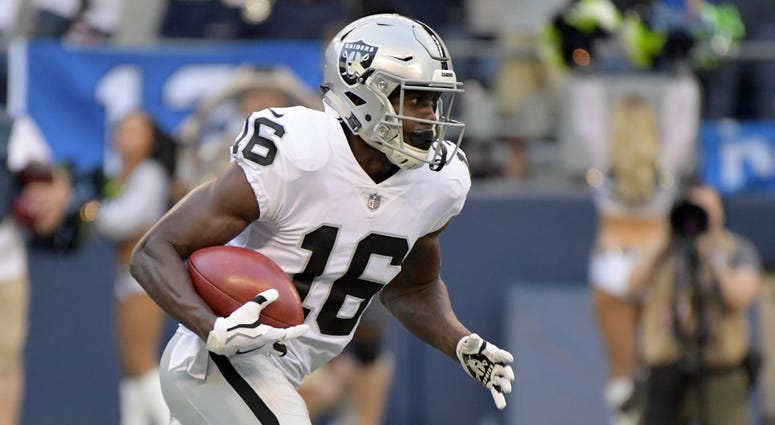 A; Oakland Raiders wide receiver Johnny Holton (16) carries the ball against the Seattle Seahawks during a preseason game