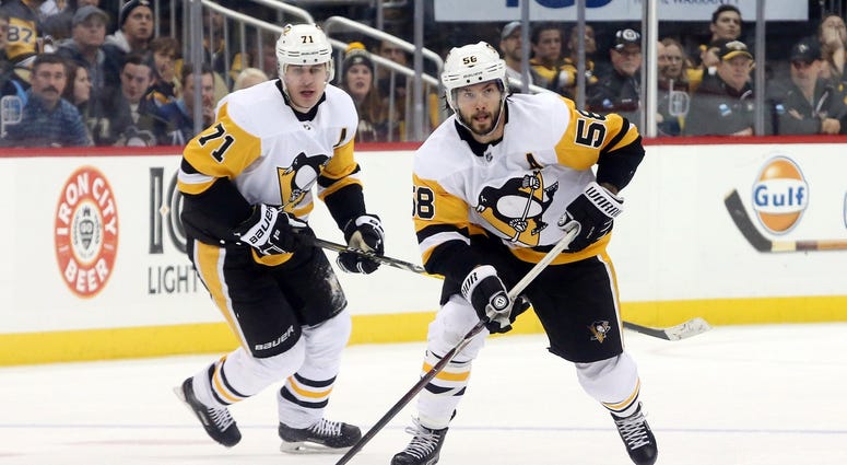 Penguins Evgeni Malkin and Kris Letang