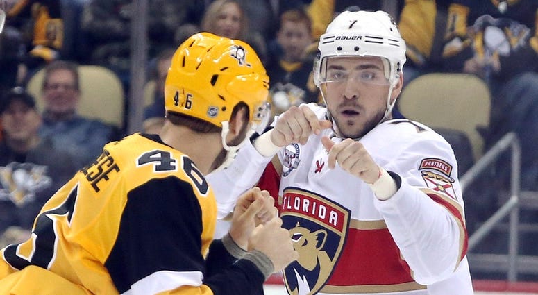 Pittsburgh, PA, USA; Pittsburgh Penguins center Zach Aston-Reese (46) and Florida Panthers center Colton Sceviour (7) fight
