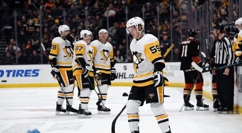 Penguins forward Jake Guentzel skates around after scoring his second hat trick of the season Friday