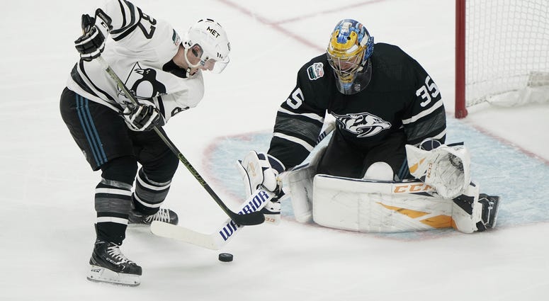 Sidney Crosby (87) of the Pittsburgh Penguins shoots against Central Division goaltender Pekka Rinne (35)