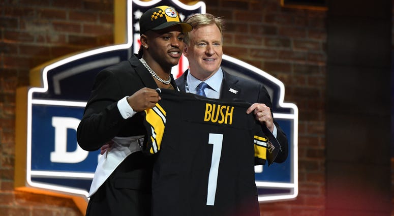 Devin Bush with Roger Goodell Devin Bush with Roger Goodell