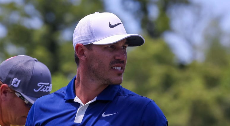 Brooks Koepka walks to the 9th hole tee box during the final round of the Zurich Classic golf tournament at TPC Louisian Brooks Koepka walks to the 9th hole tee box during the final round of the Zurich Classic golf tournament at TPC Louisian
