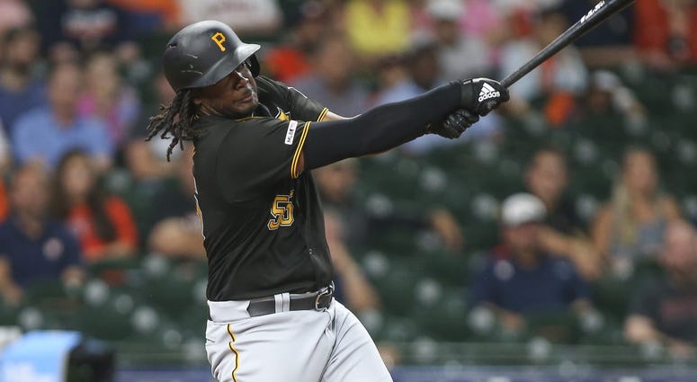 Pittsburgh Pirates designated hitter Josh Bell (55) hits a home run during the first inning against the Houston Astros at Minute Maid Park.