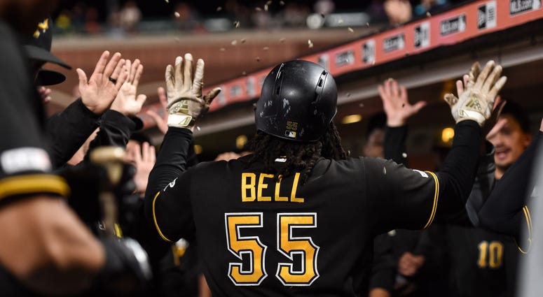 ittsburgh Pirates first baseman Josh Bell (55) celebrates with teammates in the dugout after hitting a two-run home run