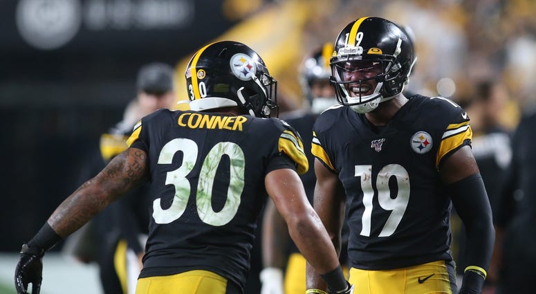 Pittsburgh Steelers running back James Conner (30) and wide receiver JuJu Smith-Schuster (19) celebrate a Steelers touchdown Pittsburgh Steelers running back James Conner (30) and wide receiver JuJu Smith-Schuster (19) celebrate a Steelers touchdown